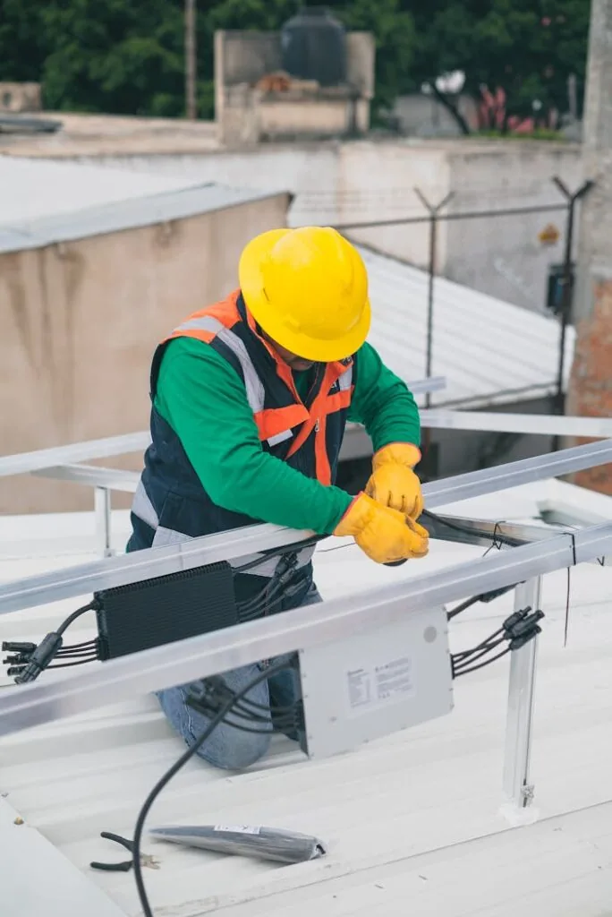 Technician installing solar panels